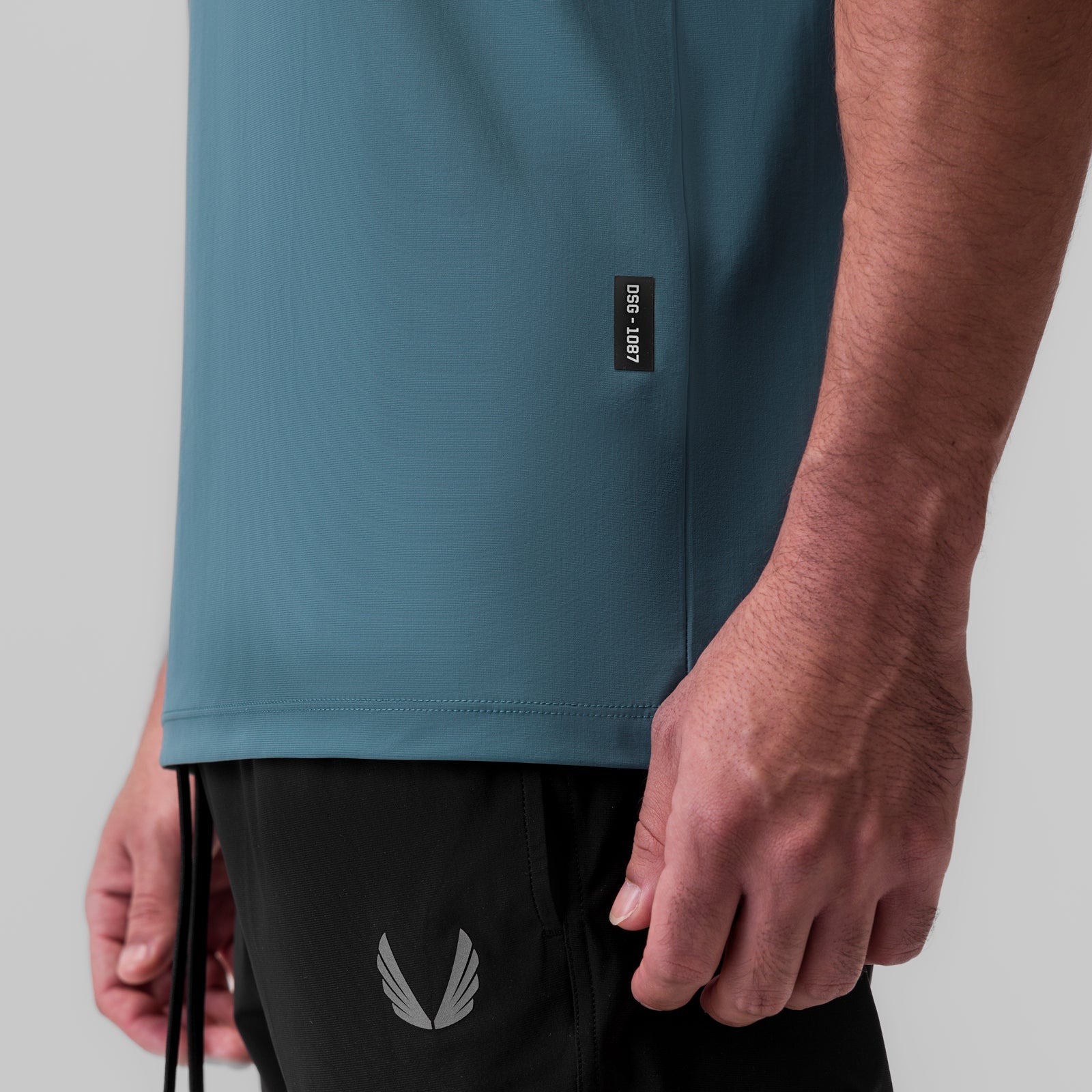 1087. Tetra-Lite® Ice Zip Tee - Storm